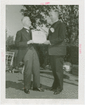 Sports - Baseball - Man receiving varsity letter certificate from other man