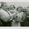 Sports - Boxing - Tony Galento receiving glass of milk from woman