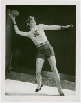 Sports - Football - Woman in Trylon and Perisphere sweater throwing football