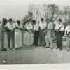 Sports - Football - New York Herald Tribune All-Star football team inspecting rifles