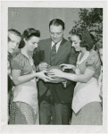 Sports - Football - Mal Stevens signing football for two girls