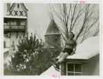 Sports - Ice Skating - Woman in ice skates posed on roof