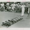 Sports - Midget Car Racing - Girl with checkered flag at starting line of model car race