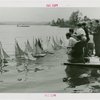 Sports - Miniature Boat Racing - Children launching model sailboats in water