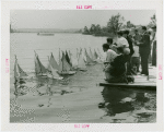 Sports - Miniature Boat Racing - Children launching model sailboats in water
