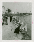 Sports - Miniature Boat Racing - Children launching model sailboats in water
