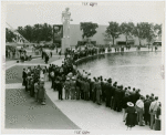 Sports - Miniature Boat Racing - Crowd watching model boat in water