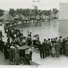 Sports - Miniature Boat Racing - Crowd watching model boat in water