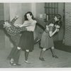 Sports - Self-Defense - Women demonstrating how to twist man's arm and how to flip man over