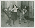 Sports - Self-Defense - Women demonstrating how to twist man's arm and how to flip man over