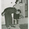 Sports - Self-Defense - Woman holding man's arm as she calls police