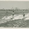 Sports - Waterskiing - Men waterskiing with women on their shoulders