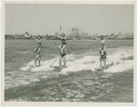 Sports - Waterskiing - Men waterskiing with women on their shoulders