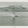 Sports - Waterskiing - Man waterskiing with woman on his shoulders