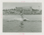 Sports - Waterskiing - Man waterskiing with woman on his shoulders