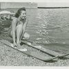 Sports - Waterskiing - Woman stepping into water-skis