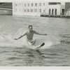 Sports - Waterskiing - Man on water-skis letting go of lead rope