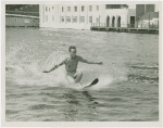 Sports - Waterskiing - Man on water-skis letting go of lead rope