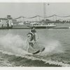 Sports - Waterskiing - Man on water-skis with woman on his shoulders