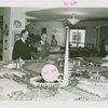 Sweden Participation - Men looking at model of Fair
