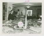 Sweden Participation - Men looking at model of Fair