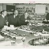 Sweden Participation - Men looking at model of Fair