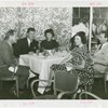 Sweden Participation - Gene Tunney with men and women in restaurant