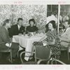Sweden Participation - Gene Tunney with men and women in restaurant