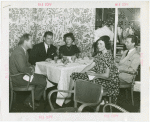 Sweden Participation - Gene Tunney with men and women in restaurant