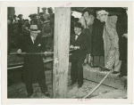 Swift Co. Participation - Grover Whalen and man sawing tree