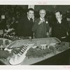 Swift Co. Participation - Charles Swift and Grover Whalen looking at model