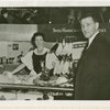 Switzerland Participation - Man and woman in souvenir shop