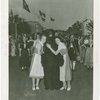 Switzerland Participation - Two women hugging person in Bear of Berne costume