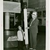 Tennessee Participation - Man and midget with giant pencil