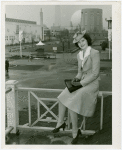 Tennessee Participation - Porter, Mary Nell (Maid of Cotton) - Sitting on railing with Fairgrounds in background