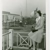 Tennessee Participation - Porter, Mary Nell (Maid of Cotton) - Sitting on railing with Fairgrounds in background