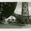 Theme Center - Trylon and Perisphere - Ceremonies - Chairs and stage set up for ceremony near framework of Trylon and Perisphere