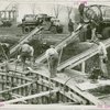 Theme Center - Trylon and Perisphere - Construction - Workers pouring concrete for foundation
