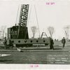 Theme Center - Trylon and Perisphere - Construction - Workers hoisting first steel frame for Perisphere
