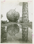 Theme Center - Trylon and Perisphere - Construction - Framework of Trylon and Perisphere, with reflection in water
