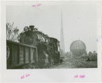 Theme Center - Trylon and Perisphere - Construction - Framework of Trylon and Perisphere with locomotive in foreground