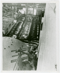 Theme Center - Trylon and Perisphere - Construction - Workers nailing plywood onto Trylon