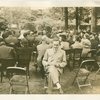 Theme Center - Trylon and Perisphere - Dedication - Man in audience reading brochure