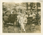 Theme Center - Trylon and Perisphere - Dedication - Man in audience reading brochure