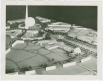 Theme Center - Trylon and Perisphere - Grover Whalen and Edward Stettinius, Jr. (U.S. Secretary of State) with others looking at Fair model
