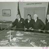 Theme Center - Trylon and Perisphere - Grover Whalen and Edward Stettinius, Jr. (U.S. Secretary of State) with others looking at Fair model