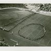 Theme Center - Trylon and Perisphere - Marching band forming shape of Trylon and Perisphere