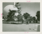 Theme Center - Trylon and Perisphere - View of Trylon and Perisphere through trees