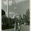 Theme Center - Trylon and Perisphere - View across grounds with two women in foreground