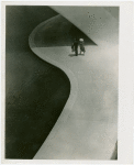 Theme Center - Trylon and Perisphere - Man and woman walking under Perisphere